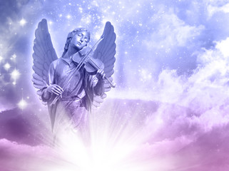 Wall Mural - an angel statue over mystical sky with divine light and stars