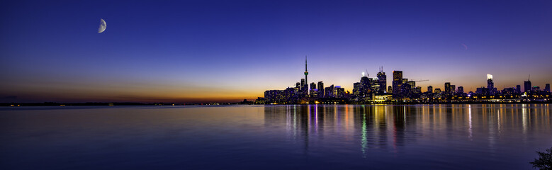 Mon over beautiful sunset in Toronto