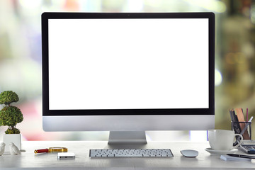 Poster - Computer on wooden table on abstract background