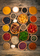 Various spices and herbs on the wooden background