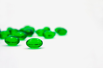 green pills soft gel capsule isolated on white background