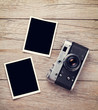 © karandaev - Vintage film camera and two blank photo frames