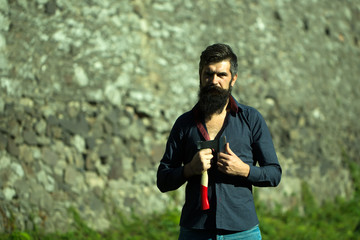 Wall Mural - Stony wall and man with ax