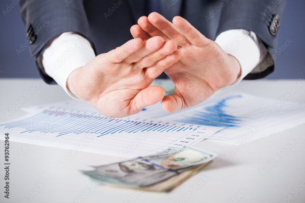 Businessman refusing money