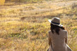 © edinorog12 - girl in coat and hat sitting and looking into the distance
