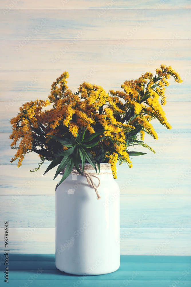 Beautiful mimosa flowers on wooden background