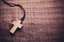 Cross On The Wooden Background