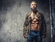 © Fxquadro - Fashion tattooed man with beard.