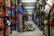 © Nejron Photo - Loader using hand pallet truck in a warehouse
