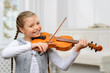 Nice girl playing the violin 