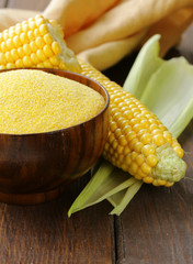 Wall Mural - Natural organic corn grits and cobs on the wooden table