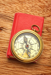 Wall Mural - Red closed book with retro compass