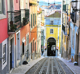 Fototapeta Uliczki - View of the colorful street with rails in Lisbon