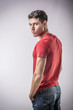 © theartofphoto - Serious young man looking at camera on light background