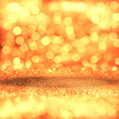 Wall Mural - Golden festive glitter background with defocused lights