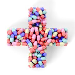 Colorful caplets in shape of medical cross, isolated on white background.