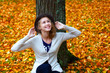 © hramovnick - Happy girl with a smile dreams. Pleasure of freedom. Autumn mood in park.