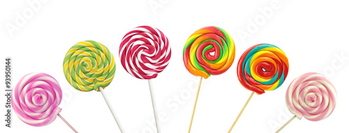 Photographie Colorful spiral lollipops on white background