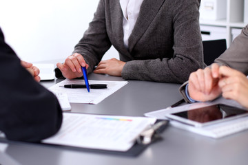 Group of business people sitting at the table and working 