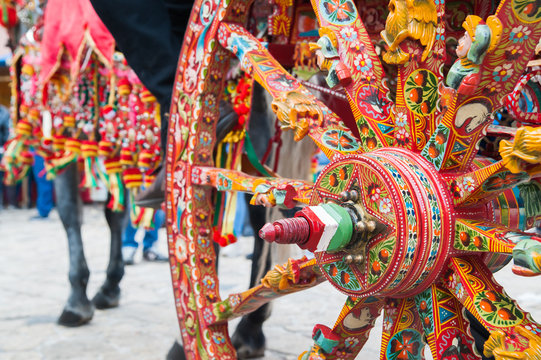 close up view of a colorful wheel of a typical sicilian cart