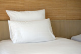 Fototapeta  - Double white pillow on white bed sheet