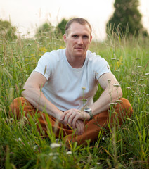 Wall Mural - Man lying in   grass