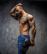 © Fxquadro - Awesome tattooed bearded man.