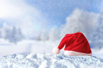 Santa Claus hat on snow at Christmas outside