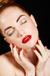 © GTeam - Studio portrait of a redhead female model.
