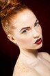 © GTeam - Studio portrait of a redhead female model.