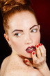© GTeam - Studio portrait of a redhead female model.