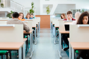 Sticker - Students studying in univeristy library