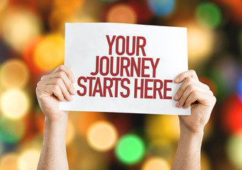 Your Journey Starts Here placard with bokeh background