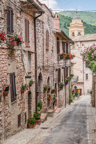 Naklejka na szybę Beautiful decorated porch in small town in Italy in summer, Umbria