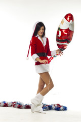 Wall Mural - Beautiful young woman dressed as Santa Claus on a white backgrou