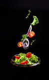 Fototapeta  - The flying salad.