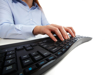 Fototapete - Hands typing on computer keyboard.