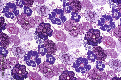Purple floral pattern on white fabric. Mauve abstract flowers print as