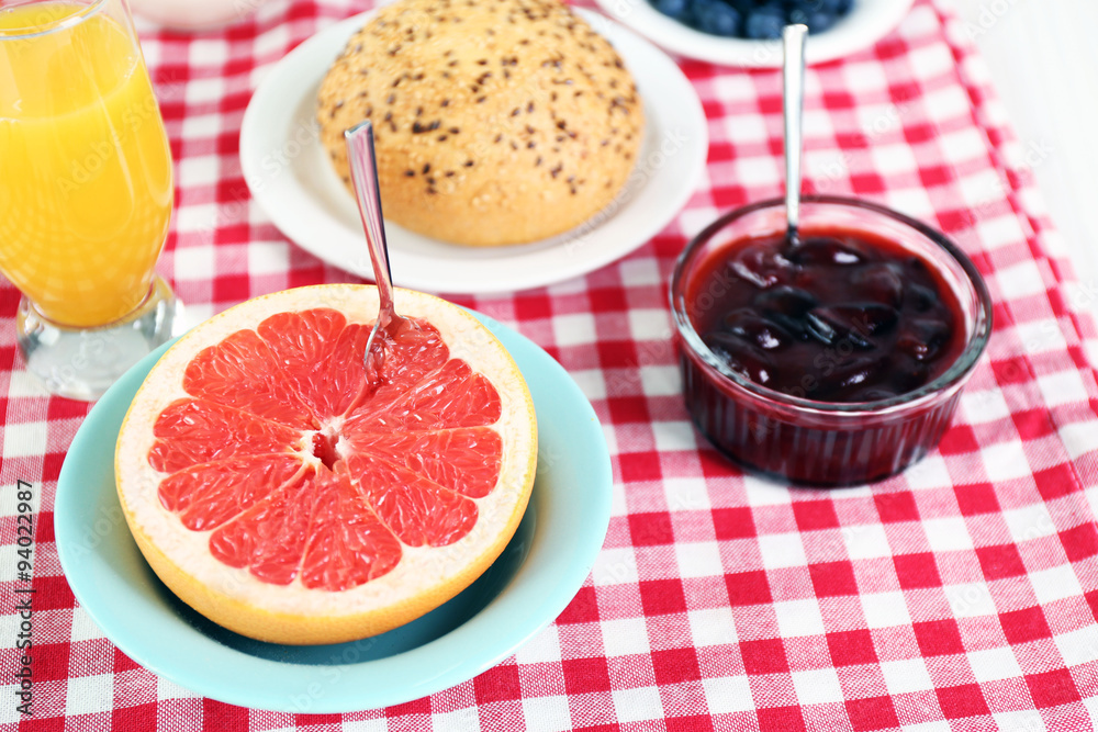 Healthy breakfast with fresh juice and grapefruit on table close up