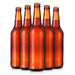 Wall Mural - Set of beer's bottles with frosty drops isolated