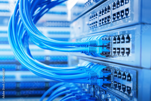 Fotografie, Obraz Network switch and ethernet cables,Data Center Concept.