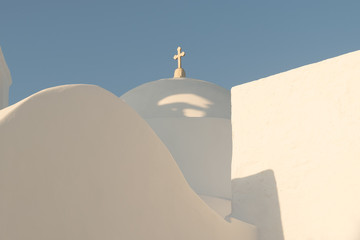 White church with light blue trulli at Paros island in Greece.
