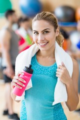 Wall Mural - Fit woman smiling at camera