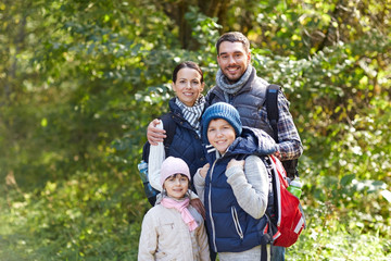 Canvas Print - happy family with backpacks hiking