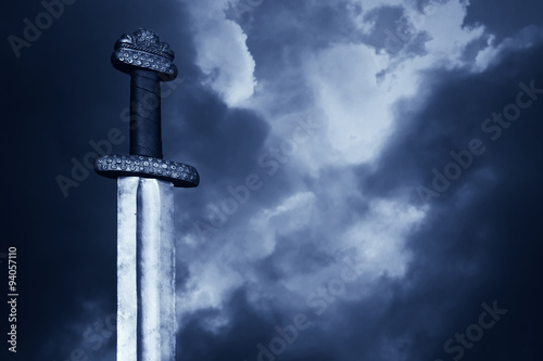 Medieval viking sword against a dramatic sky Canvas Print