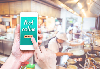 Poster - Hand holding mobile with Order food online with blur restaurant