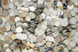 Textured background of many round metal coins from different countries