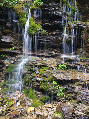 Fototapeta na wymiar Waterfall long exposure landscape image in in the Protected area Jeseniky mountains, Czech republic