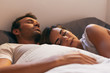 © VICTOR TORRES - Young Couple Sleeping in Bed with Morning Light