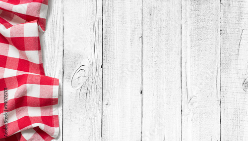 Cuadros en Lienzo red picnic tablecloth on white wood table background